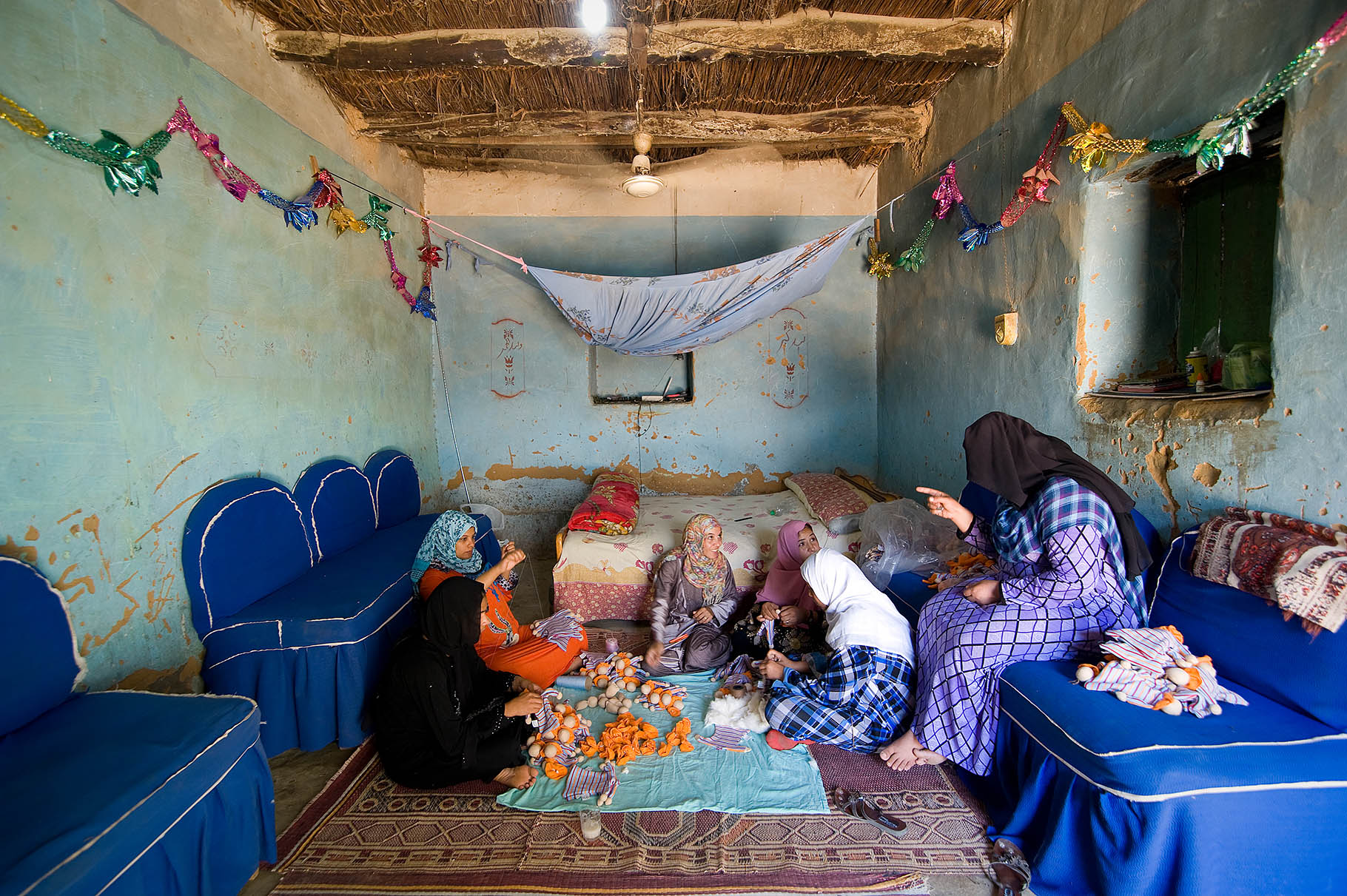 A group of people sitting around in a room.
