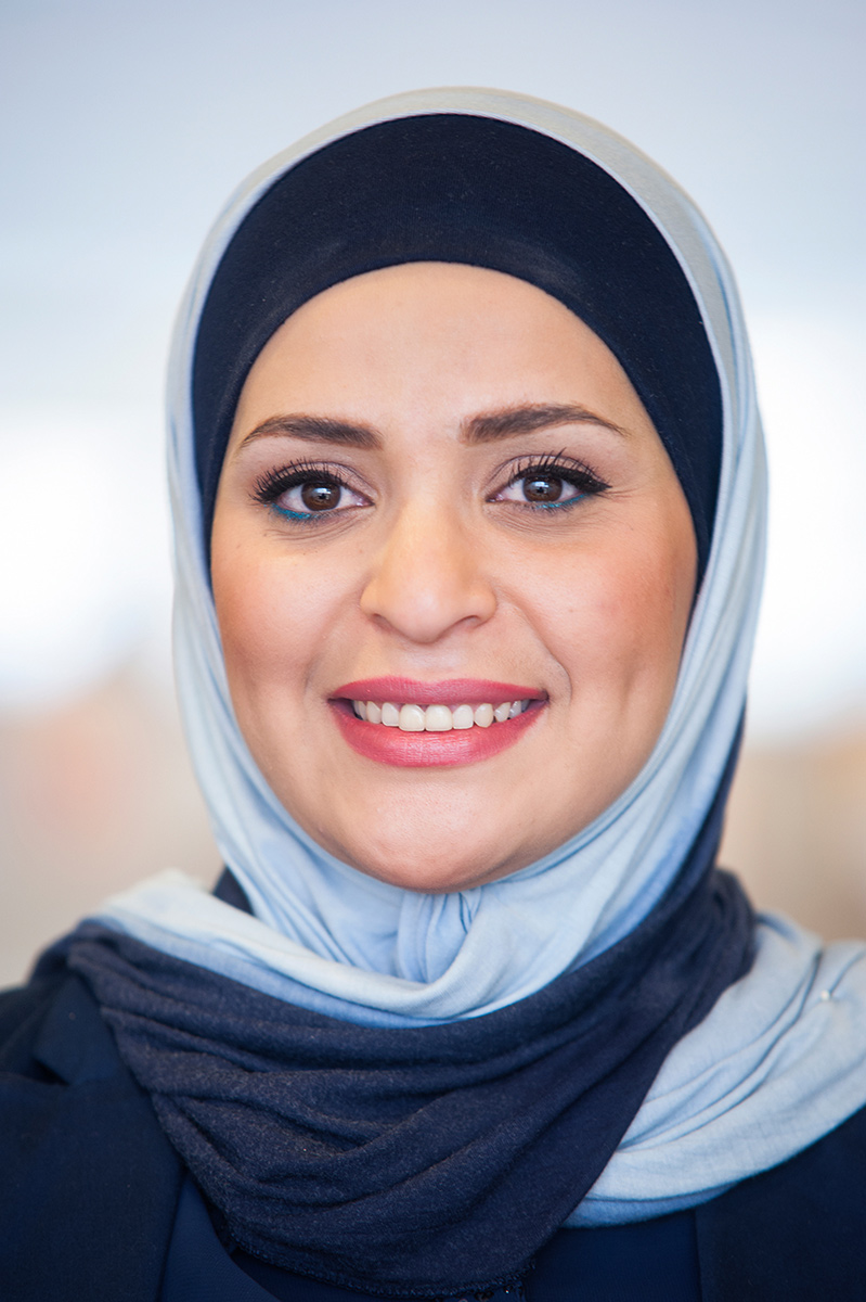A woman with blue eyes wearing a hijab. Brand Library multi-location photography