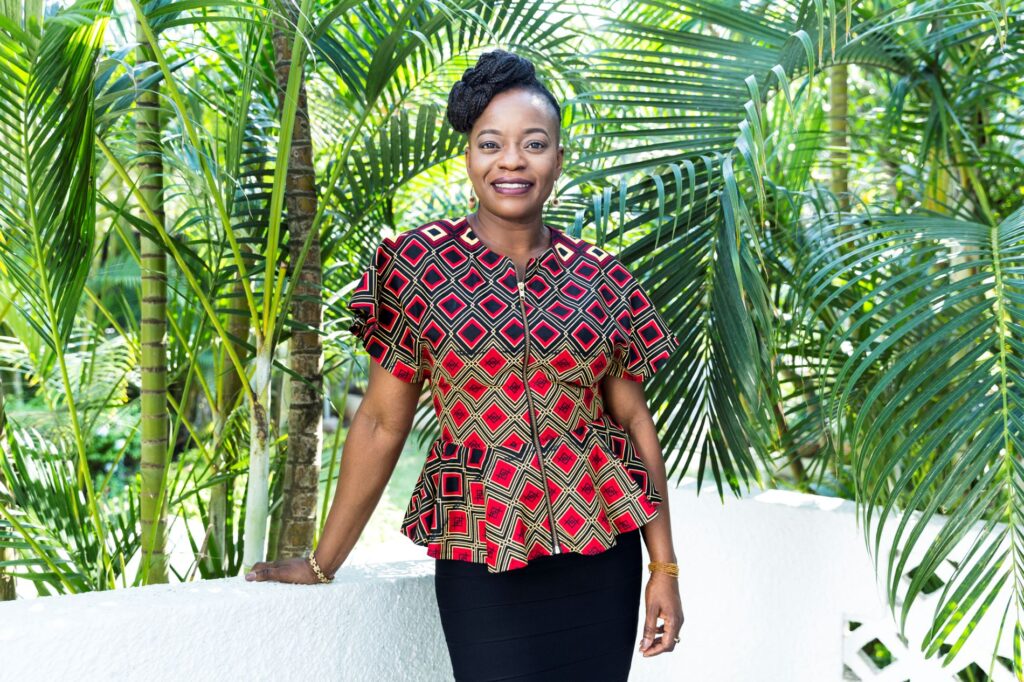 A woman standing in front of some trees, corporate brand photography