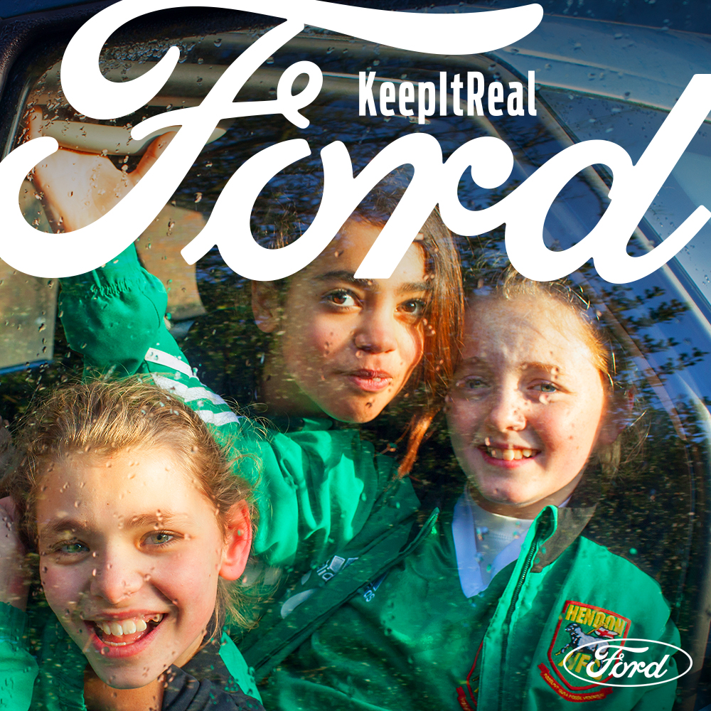 Global Assignments agency photographer Peter Dench London & UK. People, Portrait, Positive Lifestyle, Documentary Editorial Brand Library & Environmental Expertise photography. Keep it Real Ford car campaign 3 young girls in green football team kit in the back of a ford car having fun time