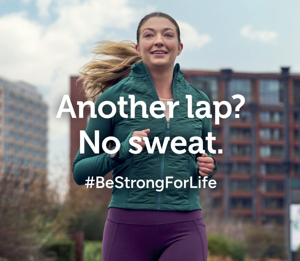 Female runner in urban park setting for health and wellbeing campaign, delivered through location production, casting and budget-managed shoot