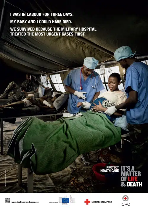 Medical team working in a temporary field hospital environment, staged for ICRC global awareness campaign
