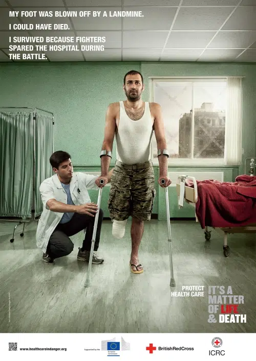 Patient with prosthetic leg in a recovery setting, photographed for ICRC Health Care in Danger campaign